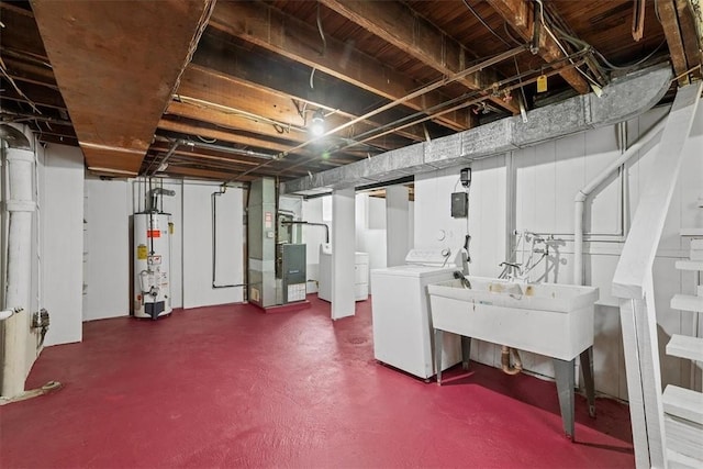 basement with washer / clothes dryer, heating unit, and gas water heater