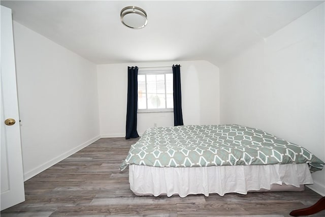 bedroom with hardwood / wood-style flooring