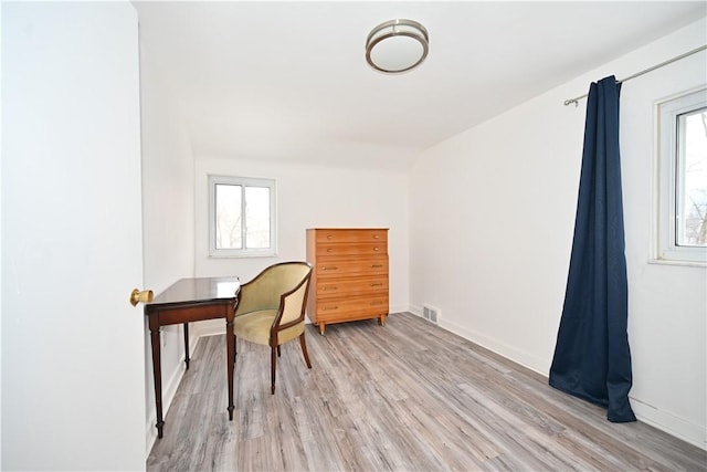 office space with light wood-type flooring