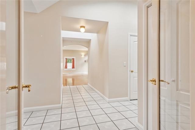 hallway featuring light tile patterned floors