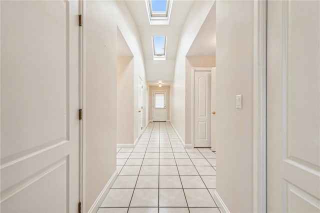 corridor featuring light tile patterned floors