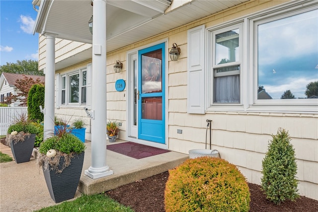 doorway to property with covered porch