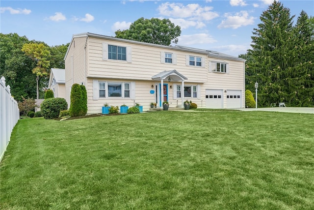 view of front facade featuring a garage and a front yard