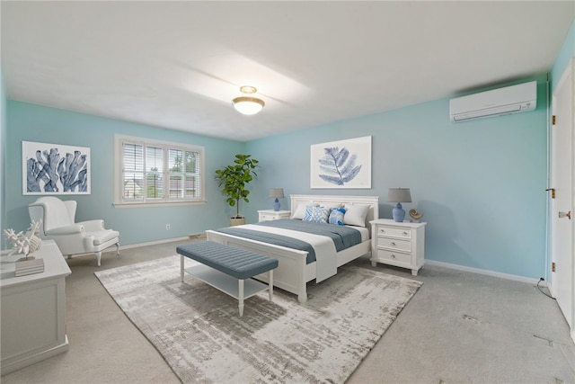 bedroom featuring light colored carpet and a wall mounted air conditioner