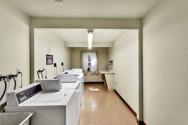 laundry room with washer and clothes dryer and sink