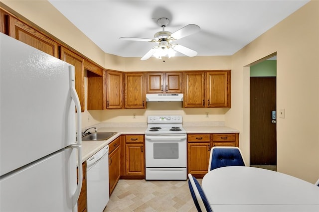 kitchen featuring white appliances, sink, and ceiling fan