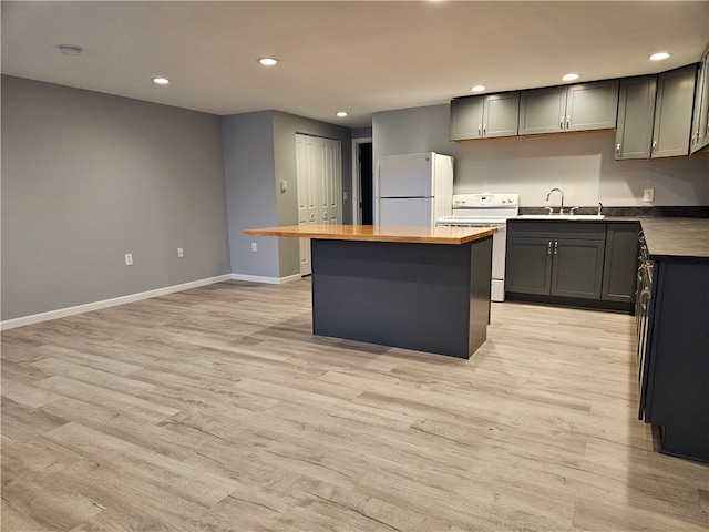 101 Main, St, PA 16050 - kitchen with gray cabinets, light wood-type flooring, a kitchen island, white appliances, and wooden counters