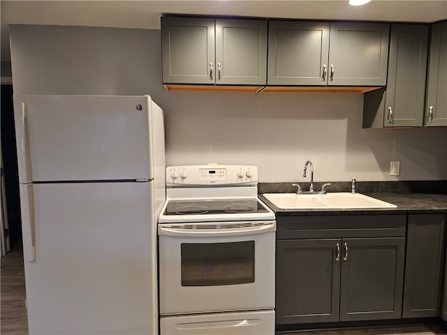 101 Main, St, PA 16050 - kitchen with wood-type flooring, sink, white appliances, and gray cabinetry