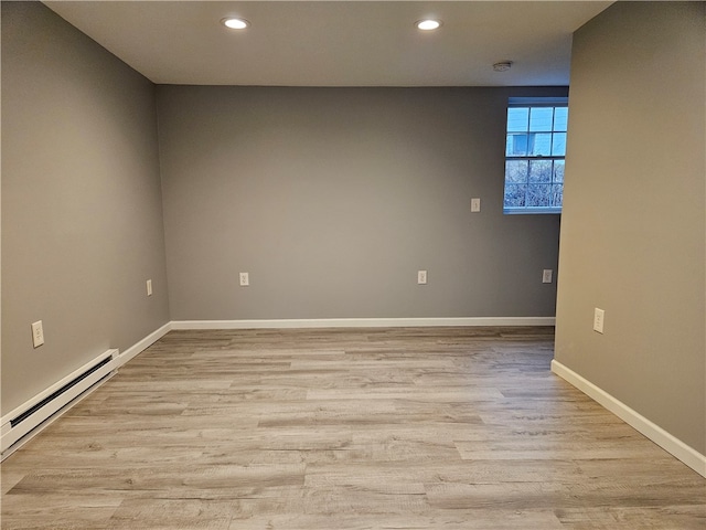 101 Main, St, PA 16050 - spare room featuring baseboard heating and light hardwood / wood-style floors