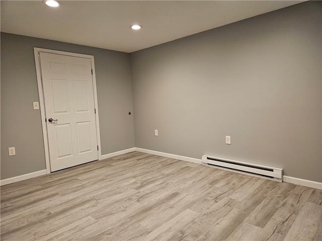 101 Main, St, PA 16050 - spare room with light hardwood / wood-style flooring and baseboard heating