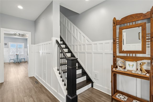 stairs featuring wood-type flooring