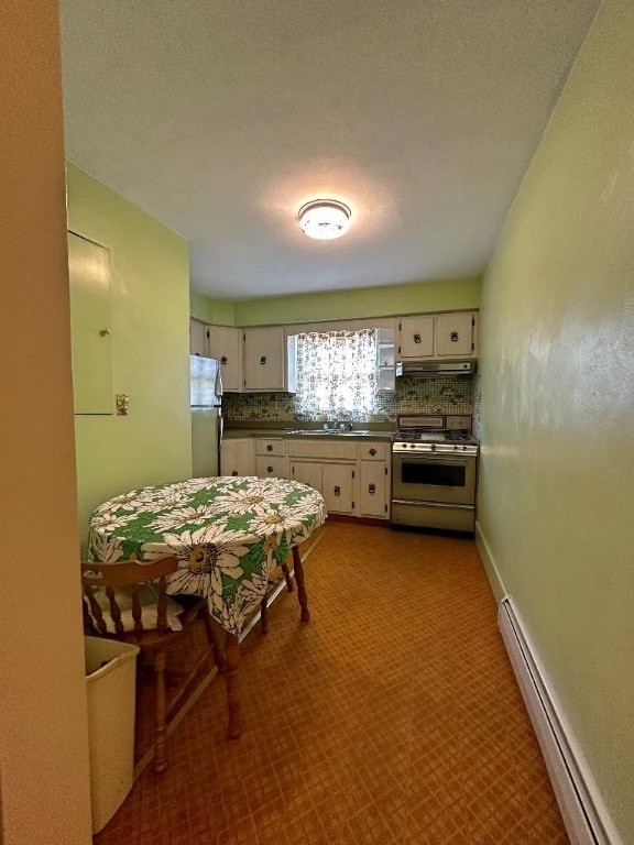 kitchen featuring tasteful backsplash, a textured ceiling, white cabinetry, stainless steel appliances, and a baseboard radiator