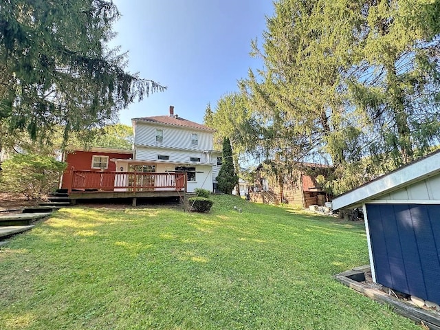 view of yard with a wooden deck