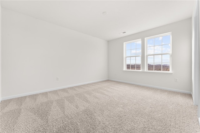 spare room featuring carpet flooring