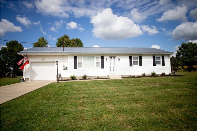 983 Vernon Rd, West Salem Twp, PA 16125 - ranch-style home featuring metal roof, concrete driveway, a garage, and a front lawn