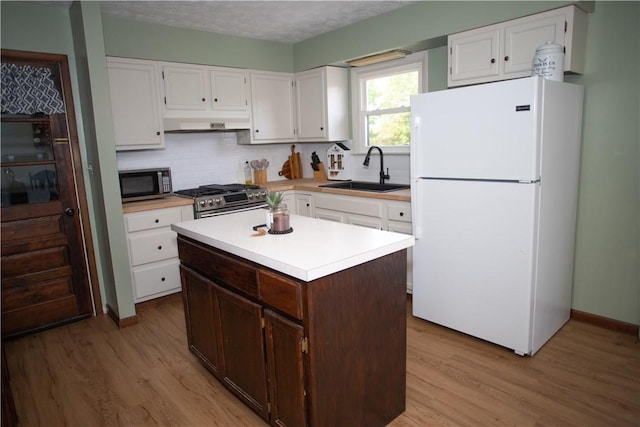983 Vernon Rd, West Salem Twp, PA 16125 - kitchen featuring white cabinets, light countertops, stainless steel appliances, and a sink