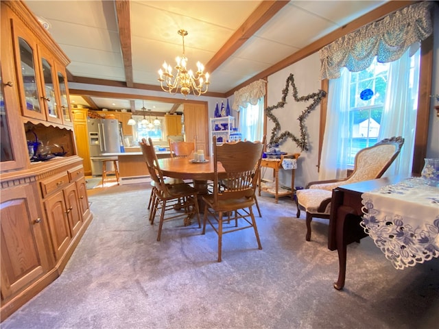 carpeted dining room featuring beamed ceiling, baseboard heating, an inviting chandelier, and a wealth of natural light