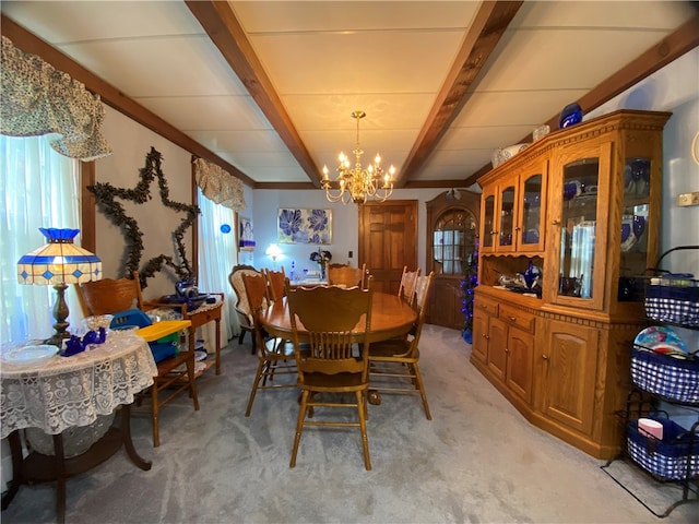 carpeted dining room with beam ceiling and a chandelier