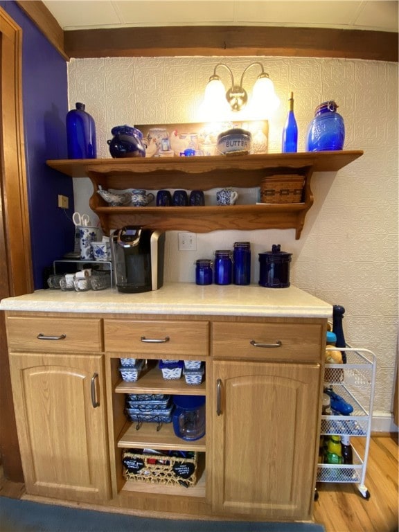 bar featuring light hardwood / wood-style floors