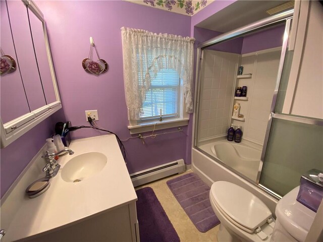 full bathroom featuring toilet, vanity, enclosed tub / shower combo, and a baseboard heating unit