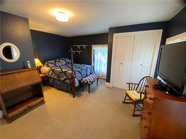 carpeted bedroom with a closet