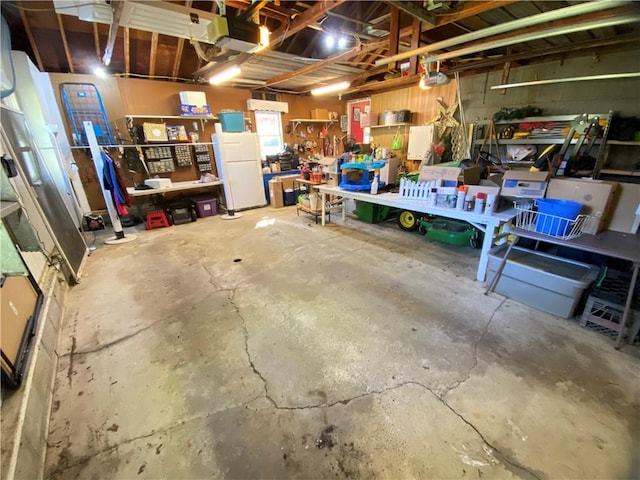 123 Leech Rd, Hempfield Twp Mer, PA 16125 - garage featuring freestanding refrigerator and a workshop area