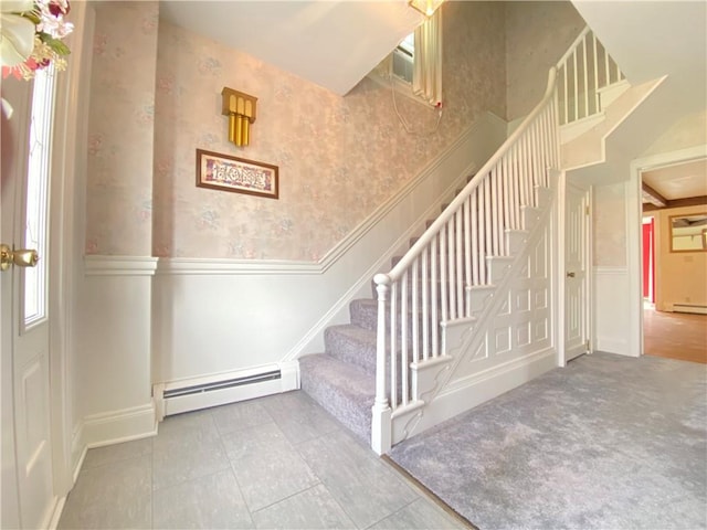 123 Leech Rd, Hempfield Twp Mer, PA 16125 - stairway with a baseboard radiator, a wainscoted wall, wallpapered walls, a decorative wall, and baseboards