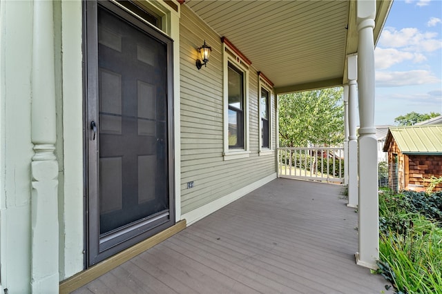 wooden terrace featuring a porch