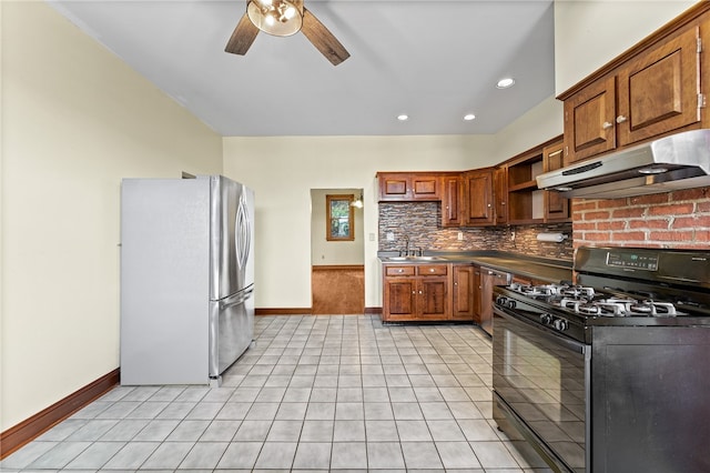 kitchen with decorative backsplash, gas stove, ceiling fan, and stainless steel fridge