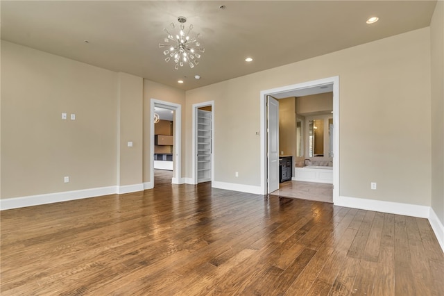 interior space featuring wood-type flooring and a notable chandelier