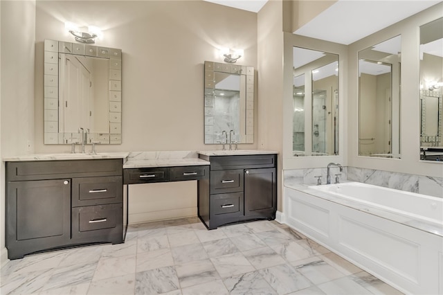 bathroom with vanity and a washtub