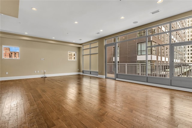 spare room featuring hardwood / wood-style floors