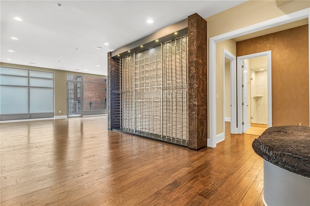 unfurnished living room featuring wood-type flooring