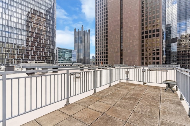 view of patio featuring a balcony