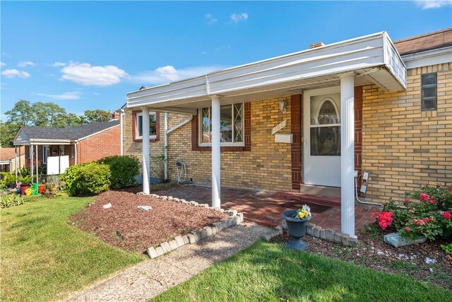 view of front of house with a front lawn and a porch