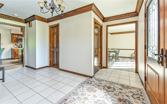 interior space featuring a notable chandelier, a wealth of natural light, light tile patterned floors, and crown molding