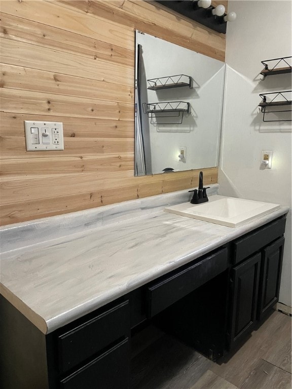 bathroom with hardwood / wood-style floors and vanity