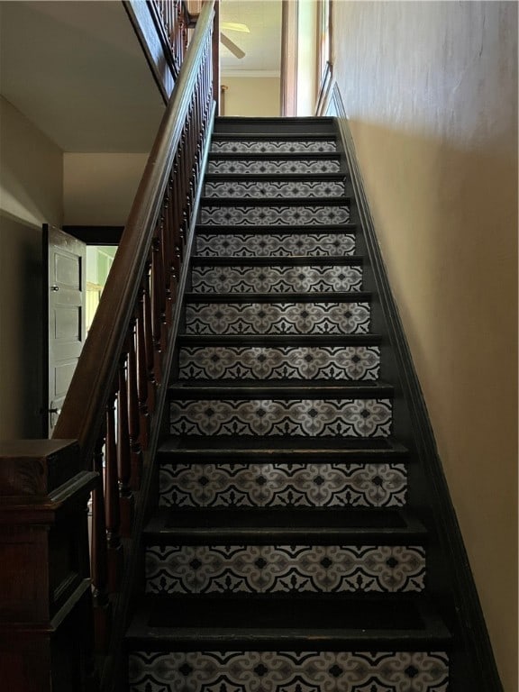 stairs with ceiling fan