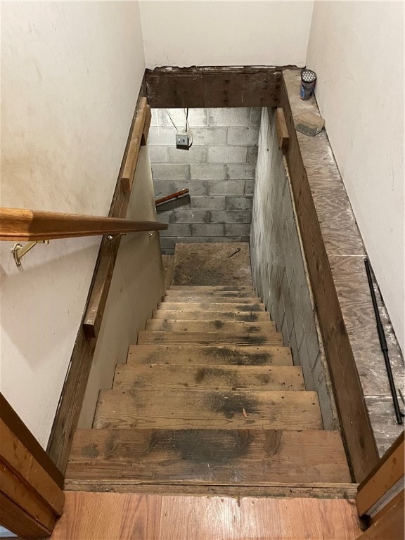 stairway featuring hardwood / wood-style floors