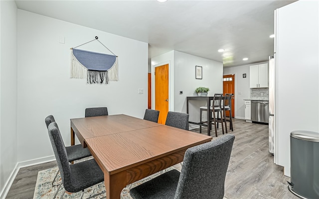 dining room featuring light hardwood / wood-style floors