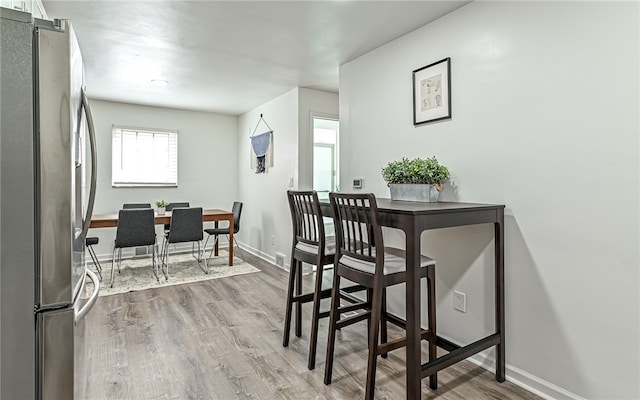 dining space featuring hardwood / wood-style floors