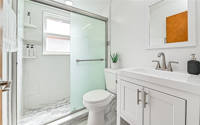 bathroom with hardwood / wood-style floors, toilet, vanity, and tiled shower