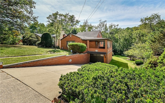 view of front of house with a front yard and a garage