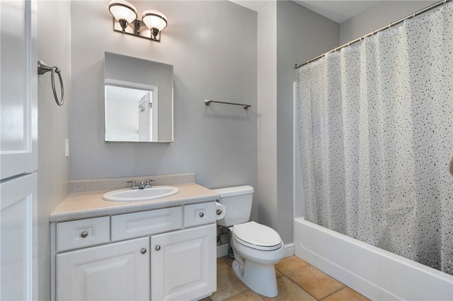 full bathroom with shower / bath combo, tile patterned flooring, vanity, and toilet