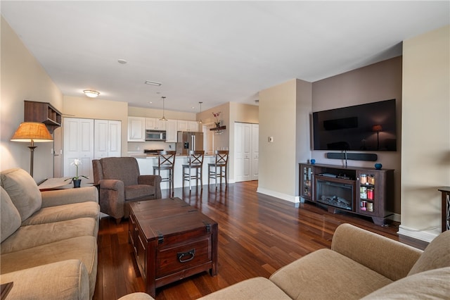 living room with dark hardwood / wood-style floors