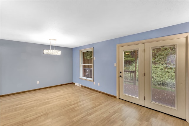 doorway to outside featuring light wood-type flooring