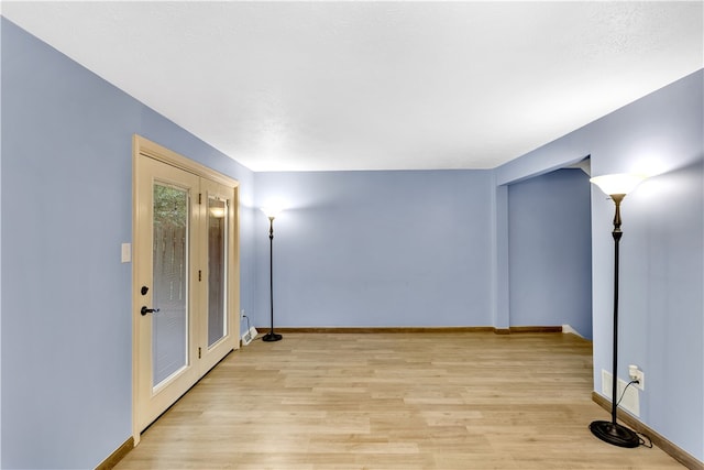 unfurnished room featuring light hardwood / wood-style flooring