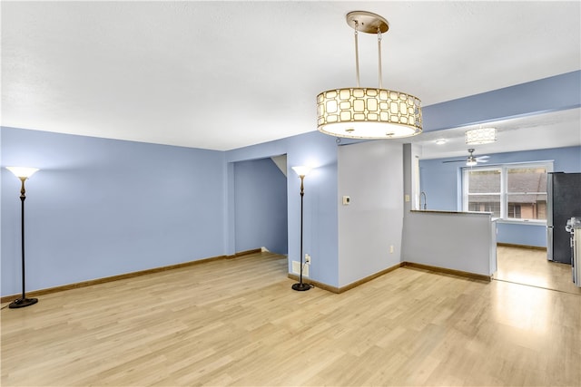 interior space featuring light wood-type flooring and ceiling fan