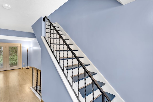 stairs with hardwood / wood-style floors