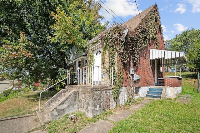 view of property exterior with a yard